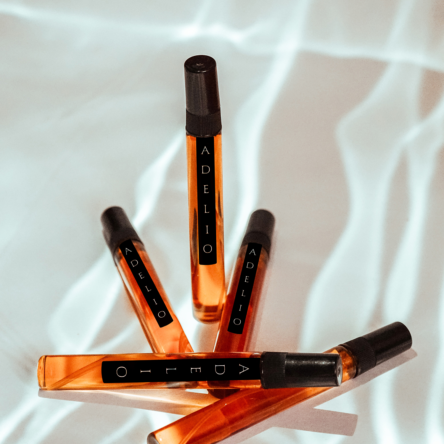 Modieus letterlogo voor Adelio parfum